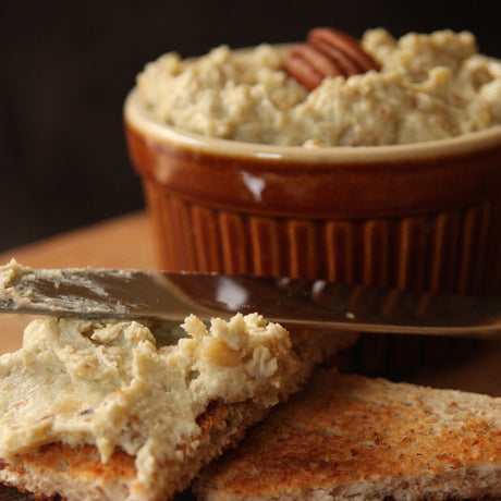 Smoked Stilton pate in ramekin & spread on slice of toast