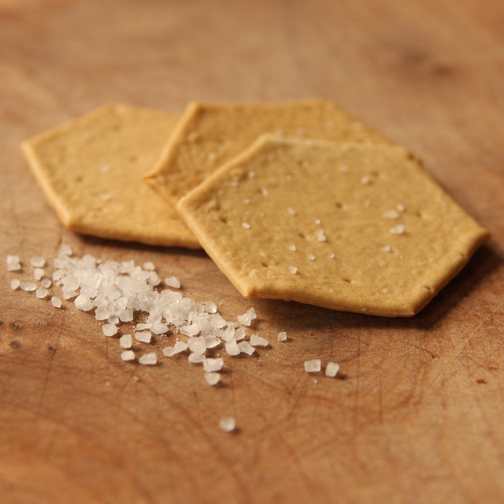 Sea salt & olive oil crackers on cheese board