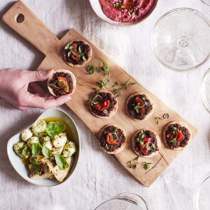 A board of canapés using sourdough crackers