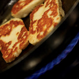 The Artisan Smokehouse's  smoked halloumi frying in pan