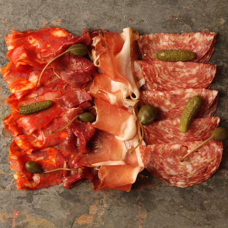 A platter filled with smoked meats 