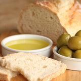 The Artisan Smokehouse's smoked Italian olive oil in ramekin with dipping bread on side