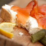 Smoked salmon and cream cheese sandwich with lemon and gherkins