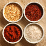  The Artisan Smokehouse's smoked spices in 4 ramekins on board